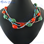 Load image into Gallery viewer, Multi-strand necklace featuring carnelian, turquoise and blue beads on a black mannequin