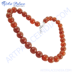 Load image into Gallery viewer, Red Carnelian bead necklace for women. Polished, round orange gemstones, strung together with a classic design, perfect for daily wear.