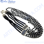 Load image into Gallery viewer, Multi-strand black bead necklace with silver clasps, a stylish statement piece.