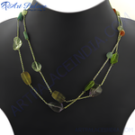 Load image into Gallery viewer, Colorful gemstone beaded necklace, featuring various semi-precious stones strung on a delicate chain, displayed on a mannequin