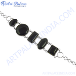 Load image into Gallery viewer, Sterling silver chain bracelet with oval, rectangle and round black onyx gemstones.