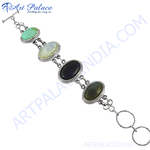 Load image into Gallery viewer, Sterling silver bracelet featuring multiple gemstones in oval settings, suitable for women
