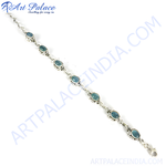 Load image into Gallery viewer, 925 sterling silver chain bracelet with oval-shaped blue aquamarine gemstones.