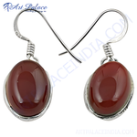 Load image into Gallery viewer, 925 sterling silver drop earrings with oval-shaped red carnelian gemstones.