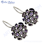 Load image into Gallery viewer, Sterling silver drop earrings with a cluster of various shapes of purple amethyst gemstones. The earrings feature a silver hook closure.