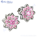 Load image into Gallery viewer, Sterling silver stud earrings featuring a flower design with pink sapphire gemstones in a cluster