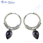 Load image into Gallery viewer, Sterling silver hoop earrings with a detailed design and teardrop-shaped amethyst gemstone.