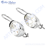 Load image into Gallery viewer, Silver drop earrings featuring oval-cut clear crystal gemstones.