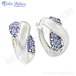 Load image into Gallery viewer, Silver hoop earrings with sparkling blue gemstones. A stunning and elegant jewelry piece.