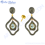 Load image into Gallery viewer, Elegant drop earrings featuring aquamarine gemstones and diamond accents, set in a gold and dark metal frame, perfect for special occasions.