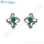 Load image into Gallery viewer, Silver stud earrings featuring oval emerald gemstones in a floral design. Green gemstone earrings for women.