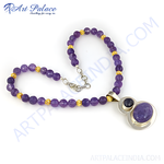 Load image into Gallery viewer, Amethyst beaded necklace with a silver pendant and purple gemstone. A beautiful necklace with gold plating accents.