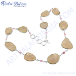 Load image into Gallery viewer, Silver necklace featuring large rose quartz stones with delicate pink accents and a silver clasp
