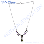 Load image into Gallery viewer, Sterling silver necklace with amethyst and peridot gemstones in a pendant design.