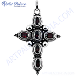 Load image into Gallery viewer, 925 sterling silver cross pendant featuring oval-cut red garnet gemstones.