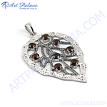 Load image into Gallery viewer, Sterling silver leaf pendant with round-cut garnet gemstones, perfect for a gift.