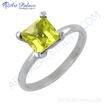Load image into Gallery viewer, Sterling silver solitaire ring with a square-cut peridot gemstone in a vibrant green hue.
