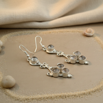 Load image into Gallery viewer, Sterling silver dangle earrings with multiple gemstones on a neutral background.
