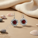 Load image into Gallery viewer, 925 sterling silver dangle earrings with a red gemstone center in a flower design.