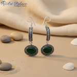 Load image into Gallery viewer, Sterling silver drop earrings featuring oval green onyx gemstones, perfect for any occasion.