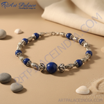 Load image into Gallery viewer, Sterling silver beaded necklace with round blue gemstones and ornate silver beads, perfect for women's fashion jewelry.