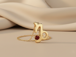 Load image into Gallery viewer, Gold Plated 925 Silver Capricorn Zodiac Necklace with Garnet colour Cubic Zirconia