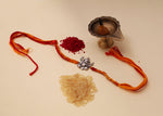 Load image into Gallery viewer, 925 Sterling Silver Ganesha charm on a red and yellow thread Rakhi bracelet.