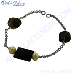 Load image into Gallery viewer, Silver chain bracelet with smoky quartz and gold accents, perfect for daily wear.
