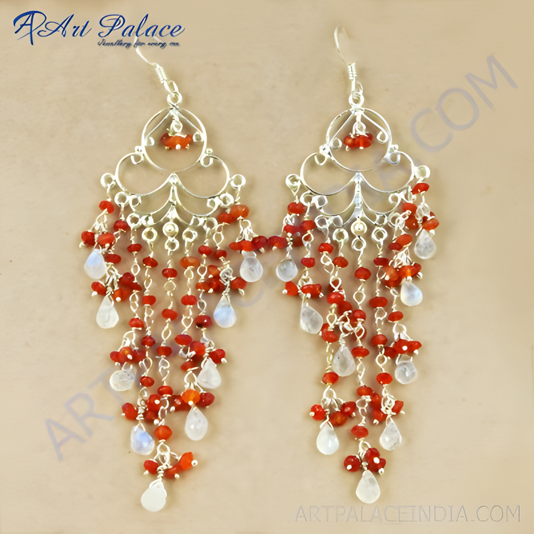 Silver dangle chandelier earrings with red beads and white moonstone gemstones.