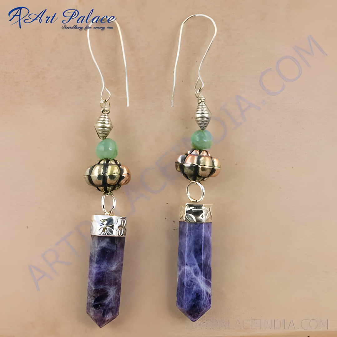 Sterling silver dangle earrings with vibrant purple sodalite gemstones and silver accents.