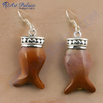Load image into Gallery viewer, Sterling silver dangle earrings featuring fish shaped gemstones in shades of brown.
