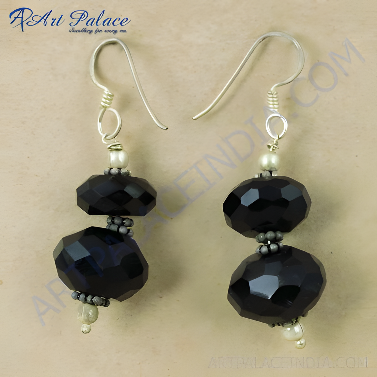 Black onyx drop earrings with faceted beads and silver accents, a striking jewelry piece for women
