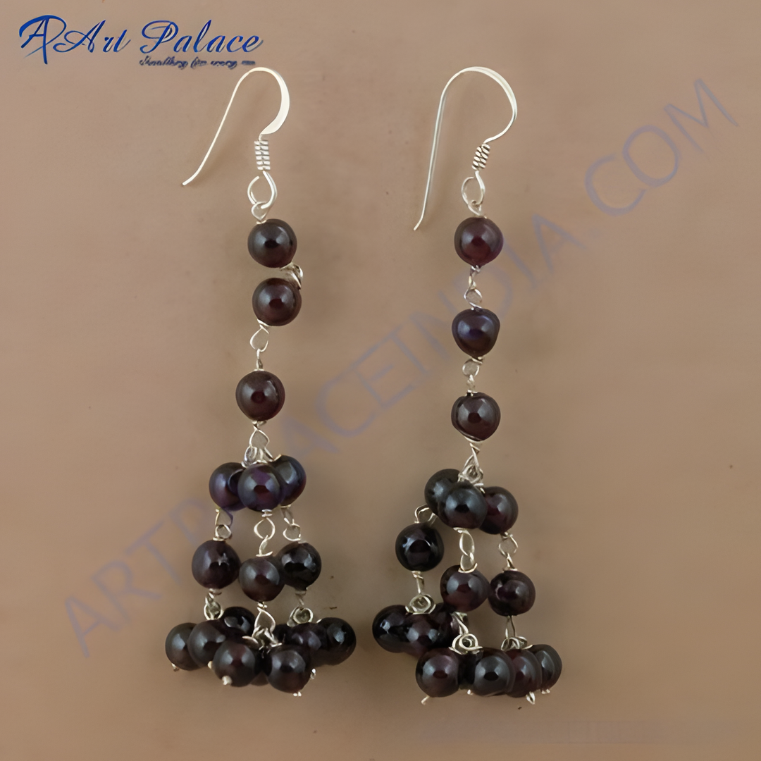 Sterling silver drop earrings with cascading garnet beads and silver hooks, showcasing a classic and elegant design.