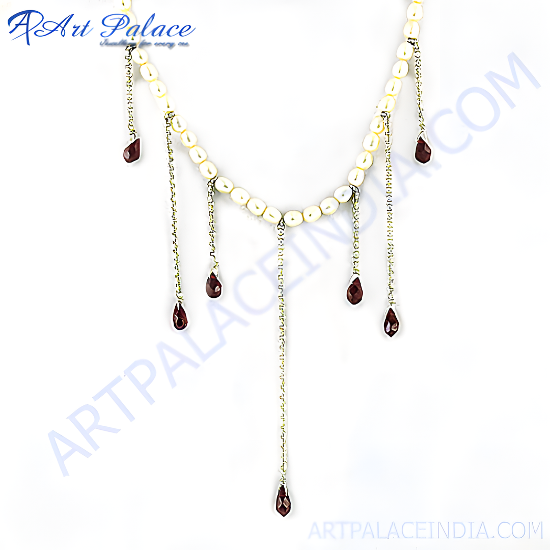 Sterling silver pearl necklace with dangling garnet gemstone drops in a teardrop shape.