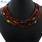 Load image into Gallery viewer, Multi-strand carnelian bead necklace with colorful gemstone accents on black mannequin
