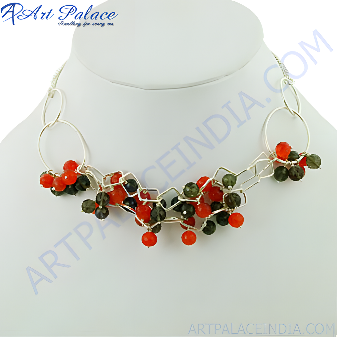 Silver statement necklace featuring red and green gemstone beads, perfect for gifting and special occasions.
