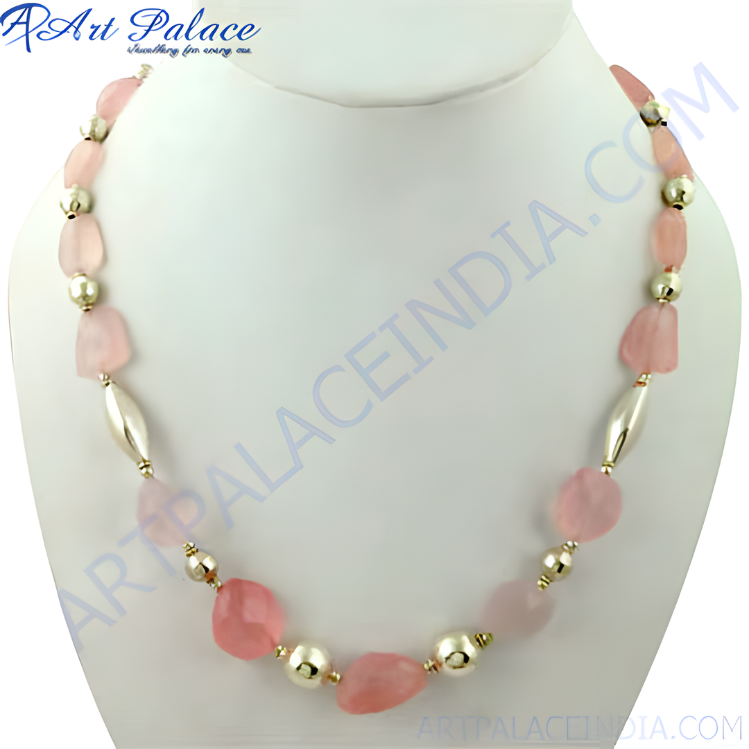 Pink rose quartz beaded necklace with gold accents, displayed on a mannequin, women's fashion jewelry.
