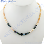 Load image into Gallery viewer, Elegant pearl necklace with multicolor pearls displayed on a white bust. Features unique pearl colors.

