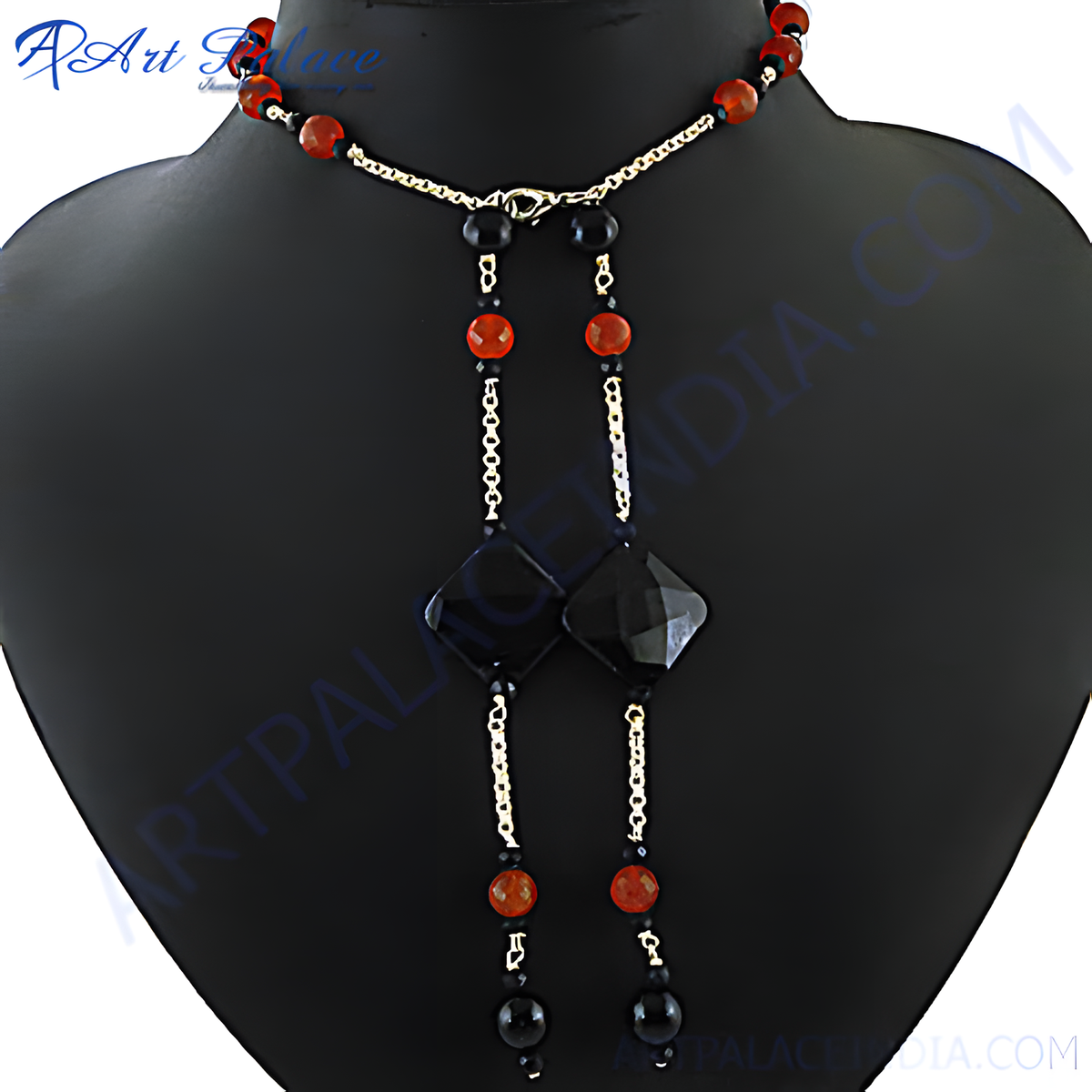 Black onyx and red agate lariat necklace displayed on a mannequin, showcasing the unique gemstone design