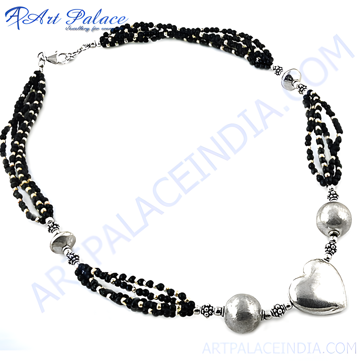 Silver beaded necklace with black beads and heart pendant on white background