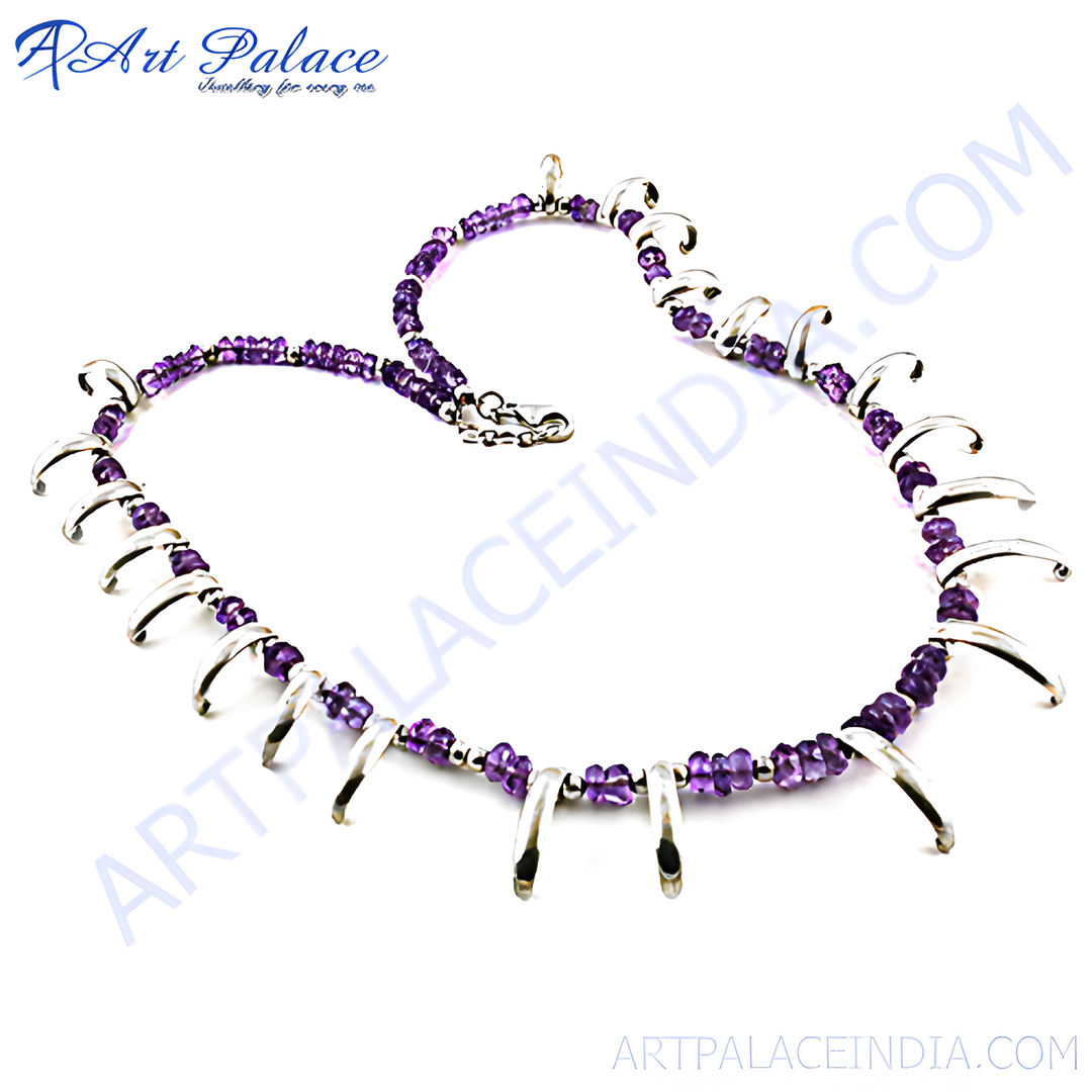 Silver necklace with amethyst gemstones. Featuring a unique and elegant design with purple stones.