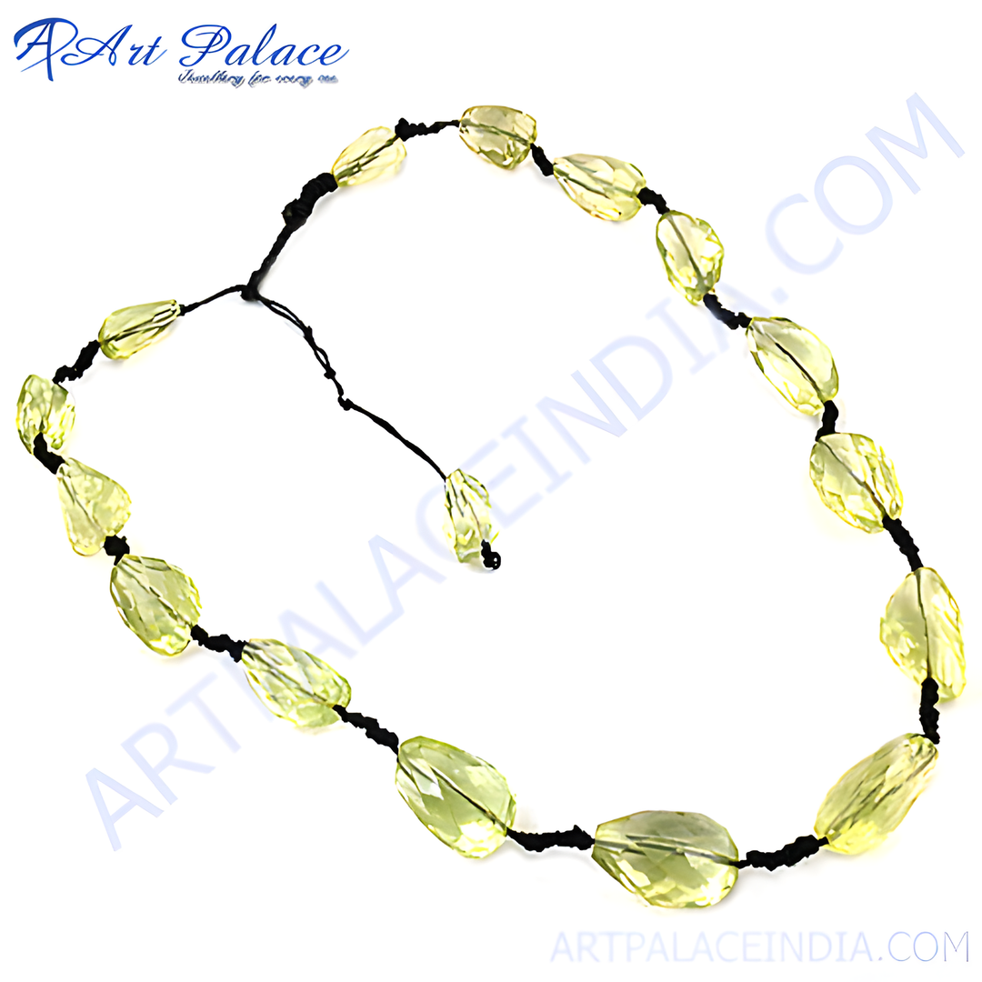 Yellow citrine beaded necklace with a black cord, showcasing the light yellow gemstones.