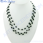 Load image into Gallery viewer, Elegant black beaded necklace on a white display stand, perfect for women&#39;s fashion jewelry.
