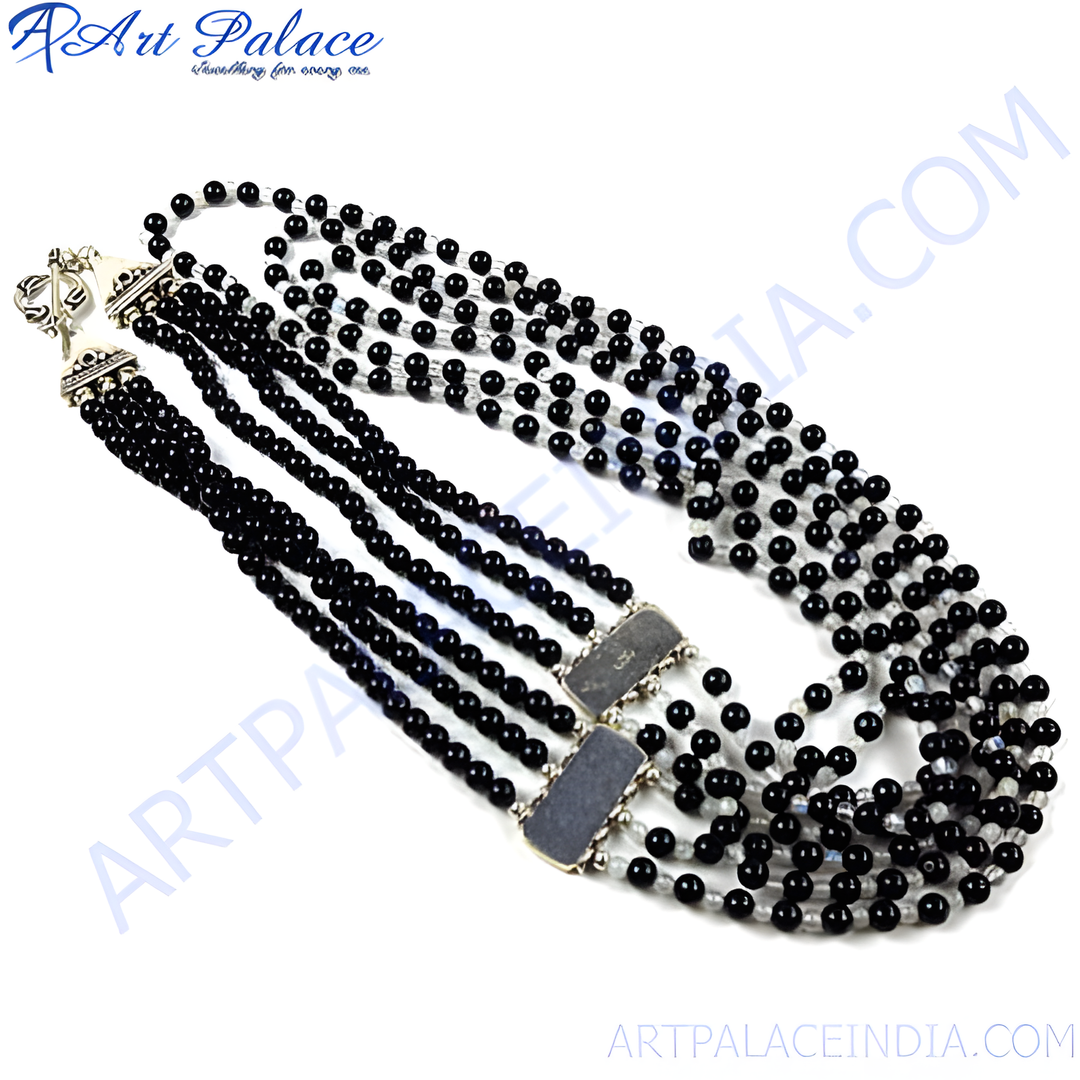 Multi-strand black bead necklace with silver clasps, a stylish statement piece.