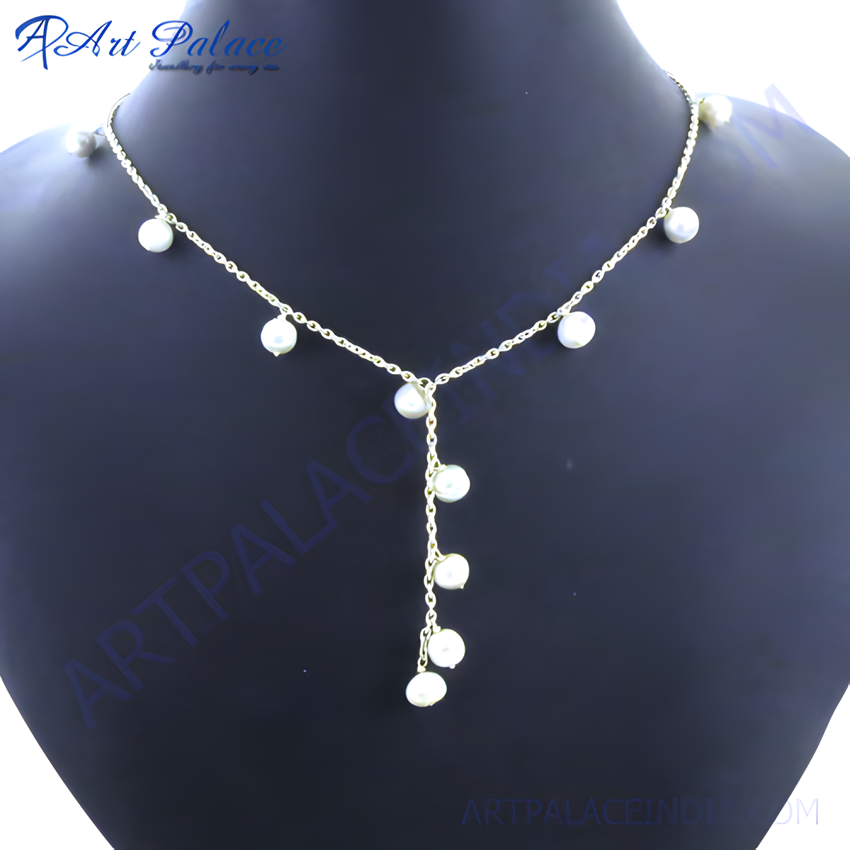 Sterling silver y necklace with multiple white pearls displayed on a mannequin