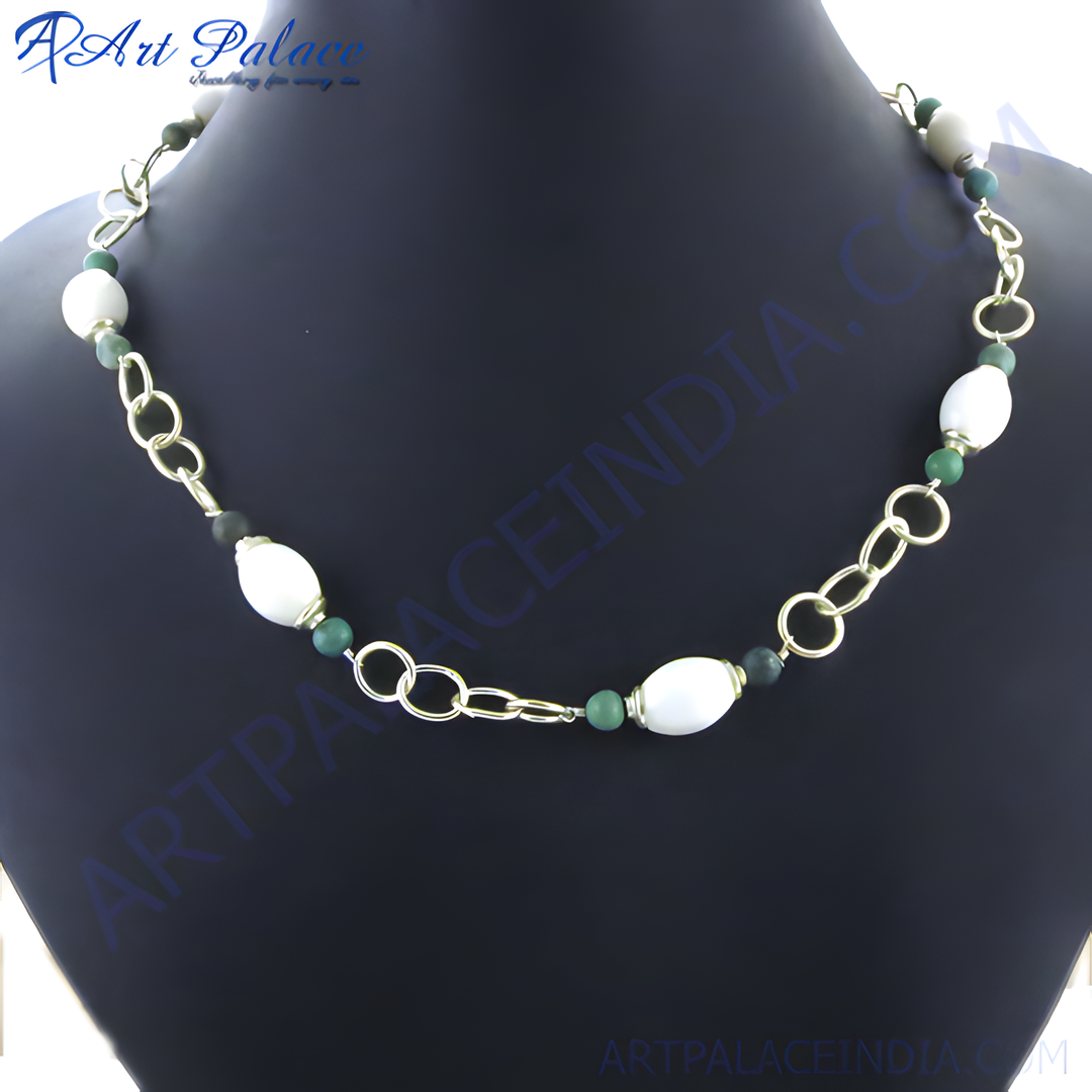 gold plating chain necklace with white and green stones displayed on a black background.