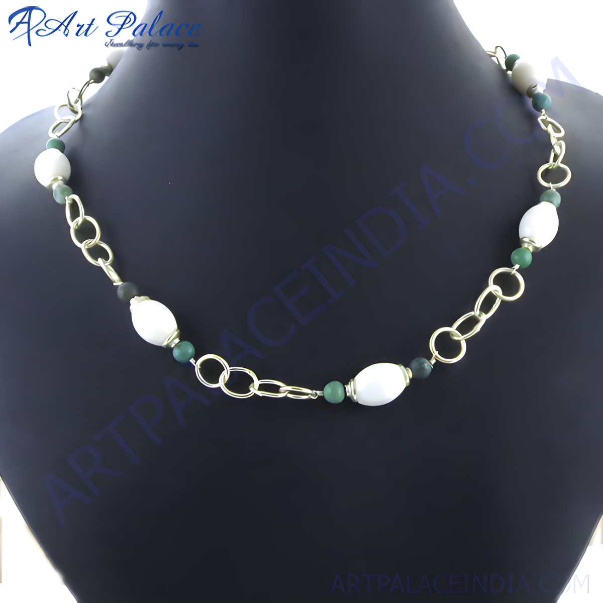 Gold plating chain necklace with white and green stones displayed on a black background