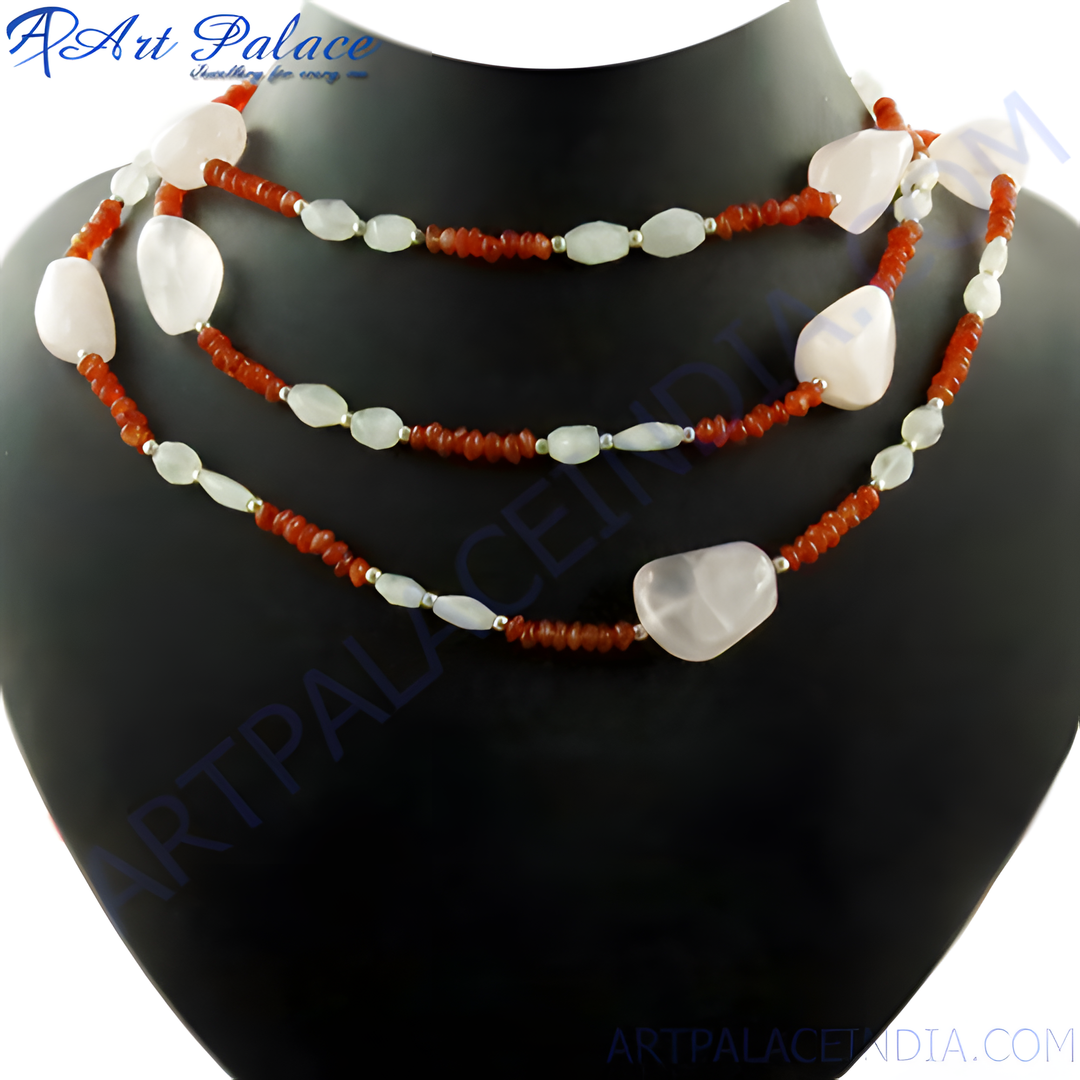 A multi-strand beaded necklace featuring pink and orange-brown gemstones displayed on a black jewelry stand.