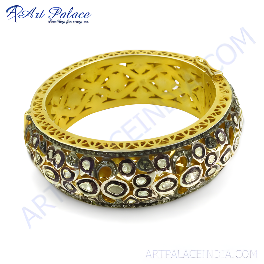 gold plating bangle bracelet with intricate design and diamonds. Luxury jewelry for women. Elegant and stylish.