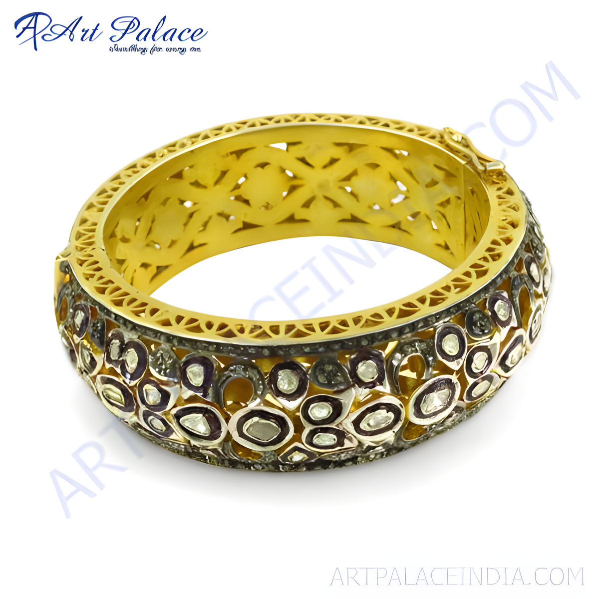 Gold bangle bracelet with intricate design and diamonds
